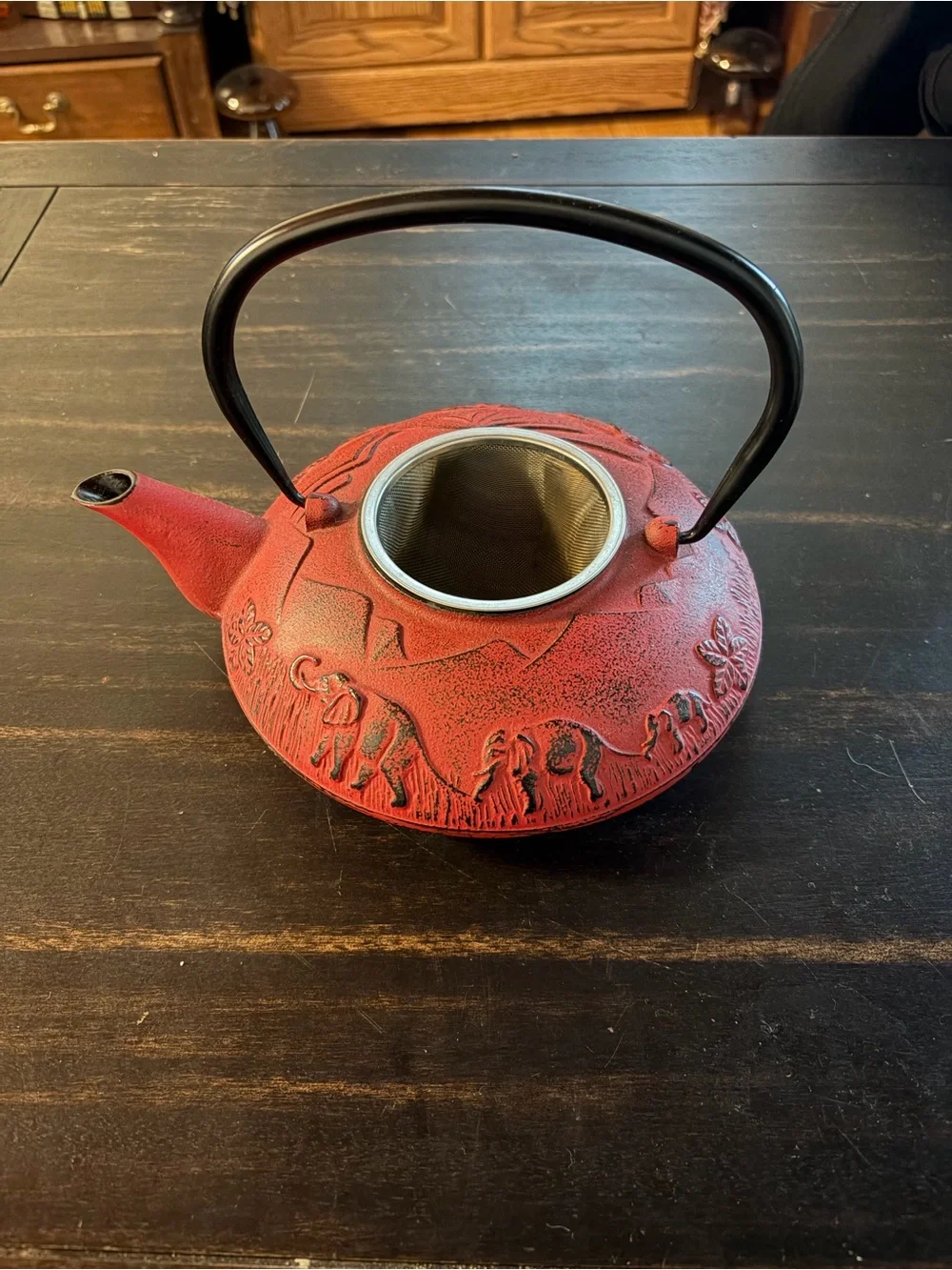 Red cast iron tea kettle